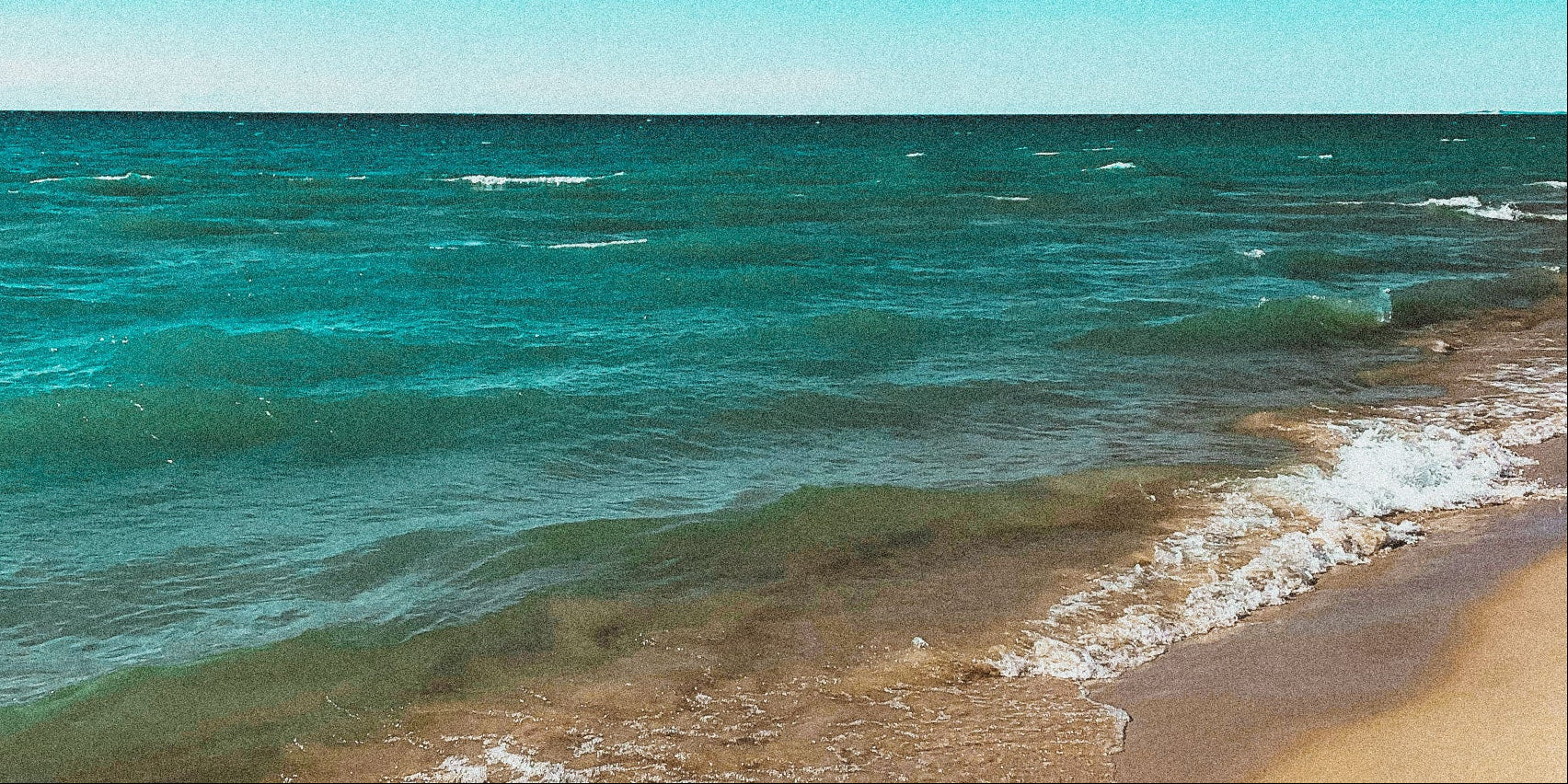 Beach with waves and turquoise water